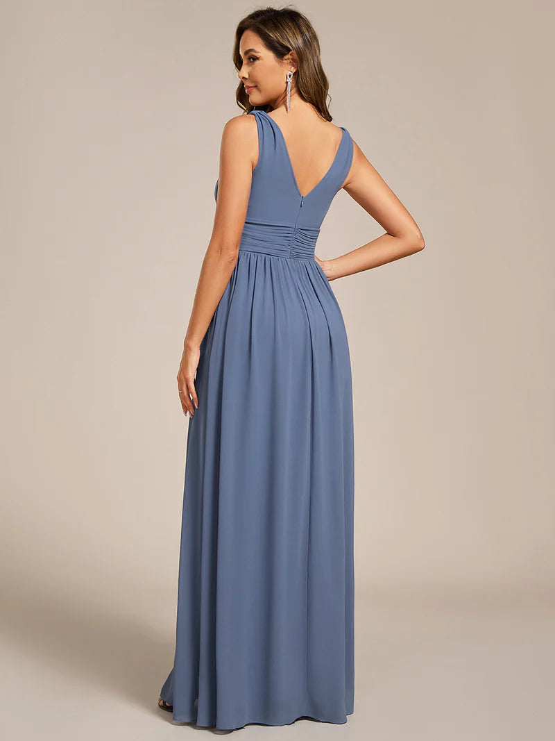 Dusty blue bridesmaid dress with double v-neck and chiffon.