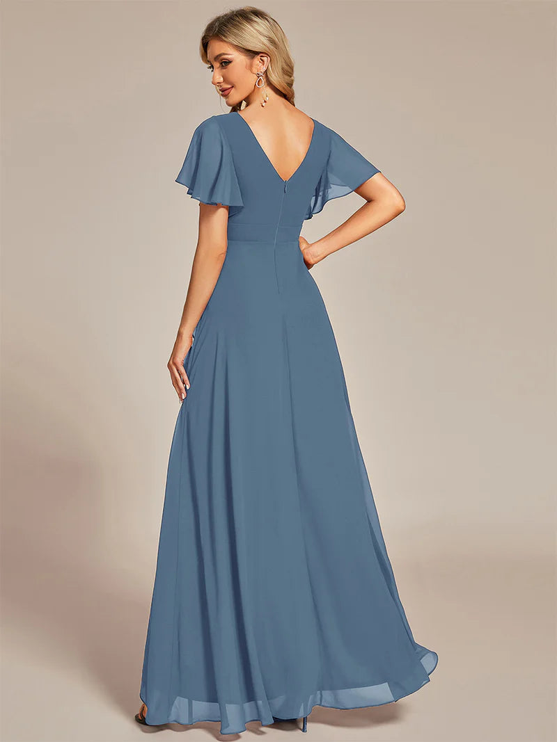 Dusty blue bridesmaid dress with high low ruffle and chiffon.