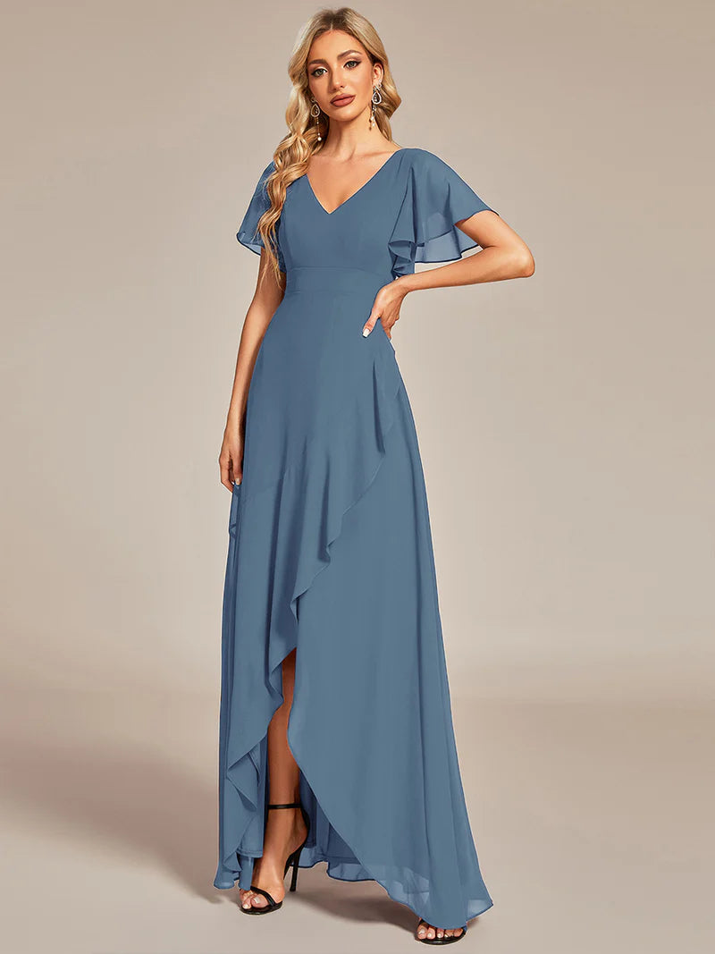 Dusty blue bridesmaid dress with high low ruffle and chiffon.