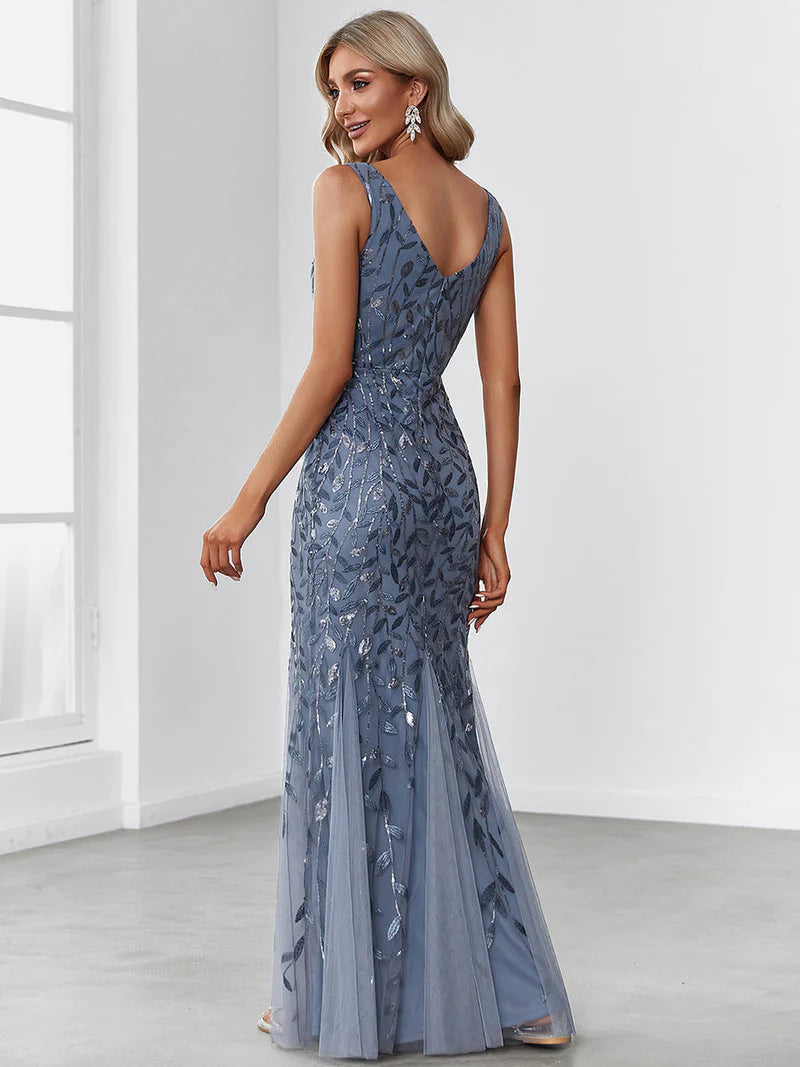 Dusty blue formal dress with fishtail and sequins.