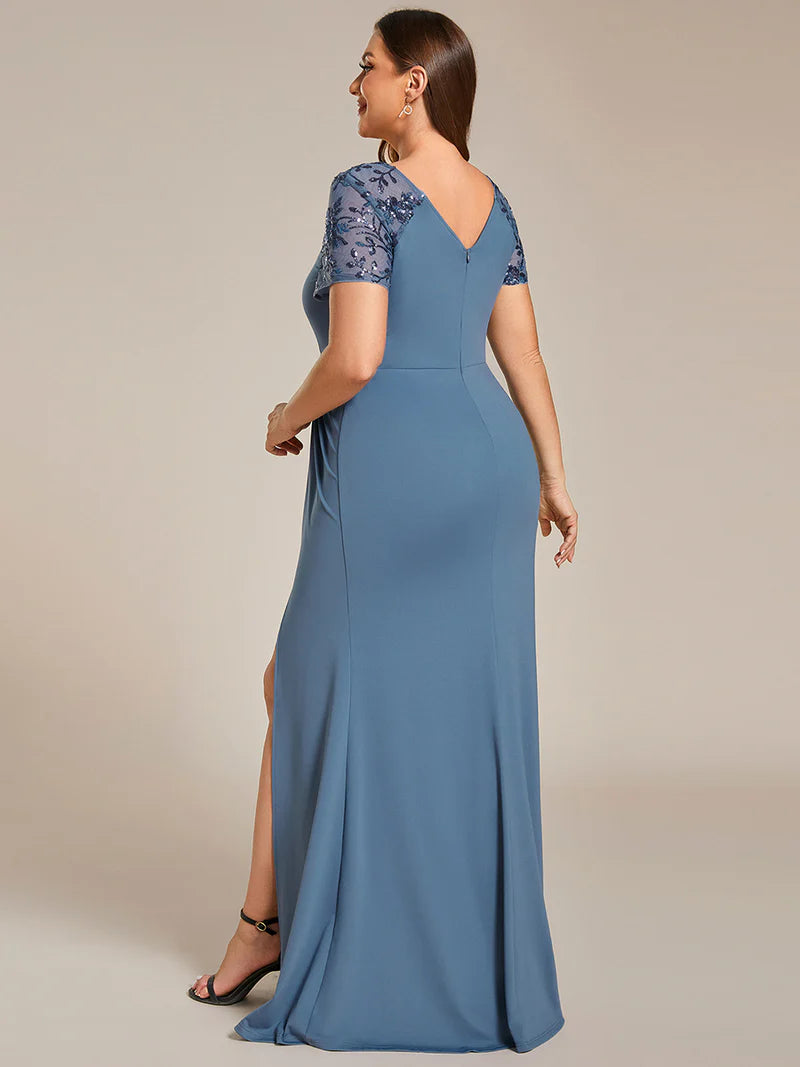 An elegant plus size mother of the bride long dusty blue applique cap sleeved evening dress, ruched at the middle.