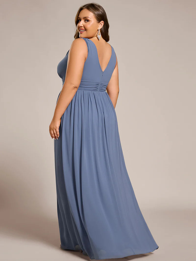 Dusty blue plus sized bridesmaid dress with double v-neck and chiffon.