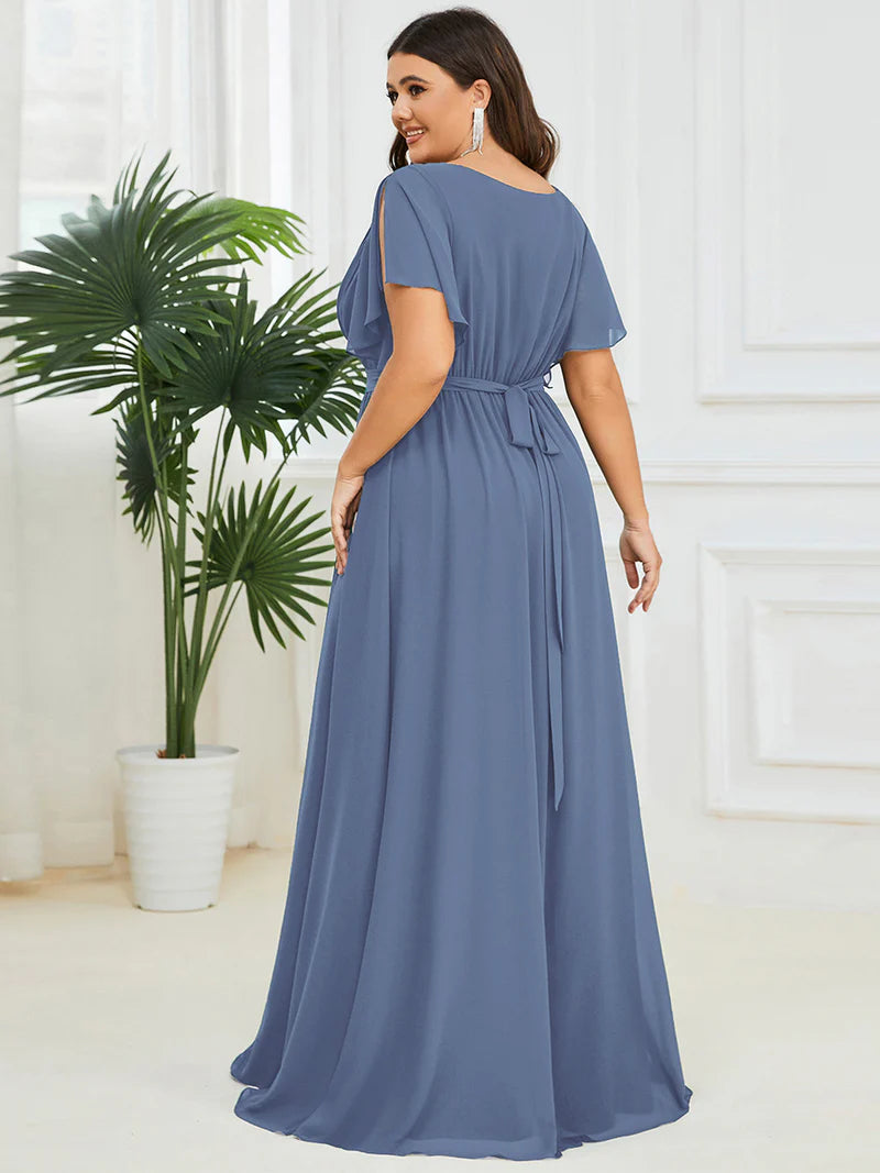 Dusty blue plus sized bridesmaid dress with v-neck and a-line.
