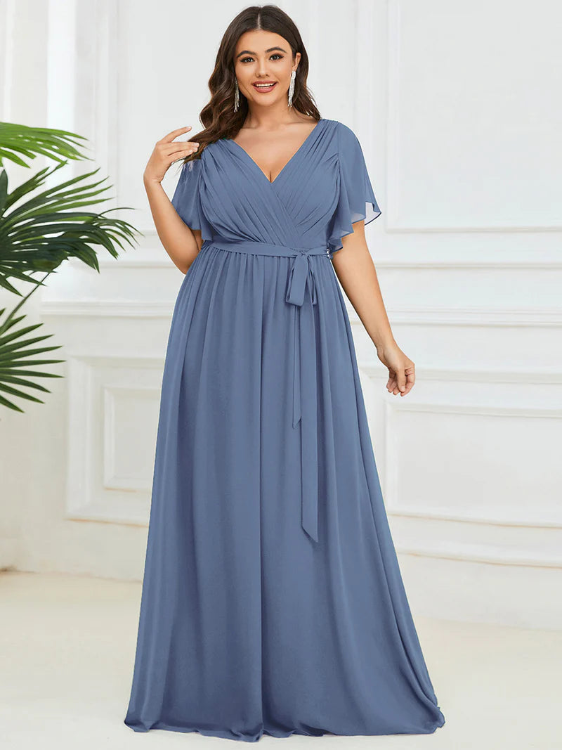 Dusty blue plus sized bridesmaid dress with v-neck and a-line.