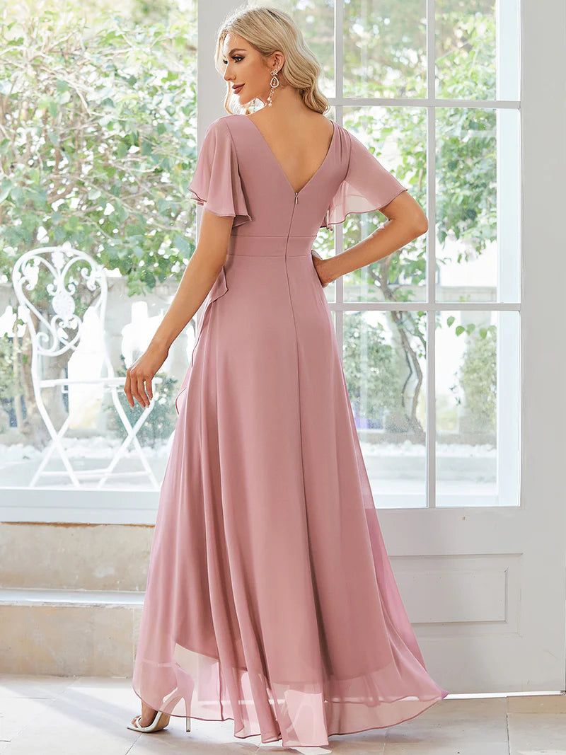 Dusty rose bridesmaid dress with high low ruffle and chiffon.