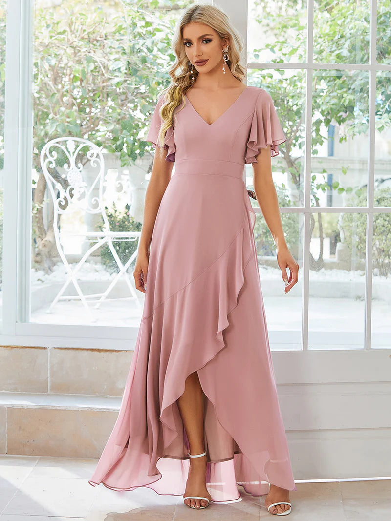 Dusty rose bridesmaid dress with high low ruffle and chiffon.