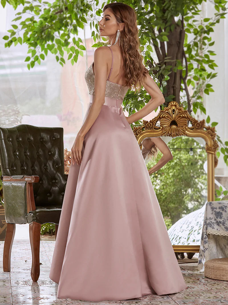 Dusty rose hi low sleeveless satin formal or mother of the bride dress with bodice detailing.