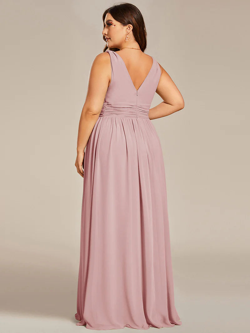 Dusty rose plus sized bridesmaid dress with double v-neck and chiffon.