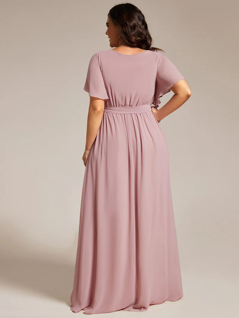 Dusty rose plus sized bridesmaid dress with v-neck and a-line.