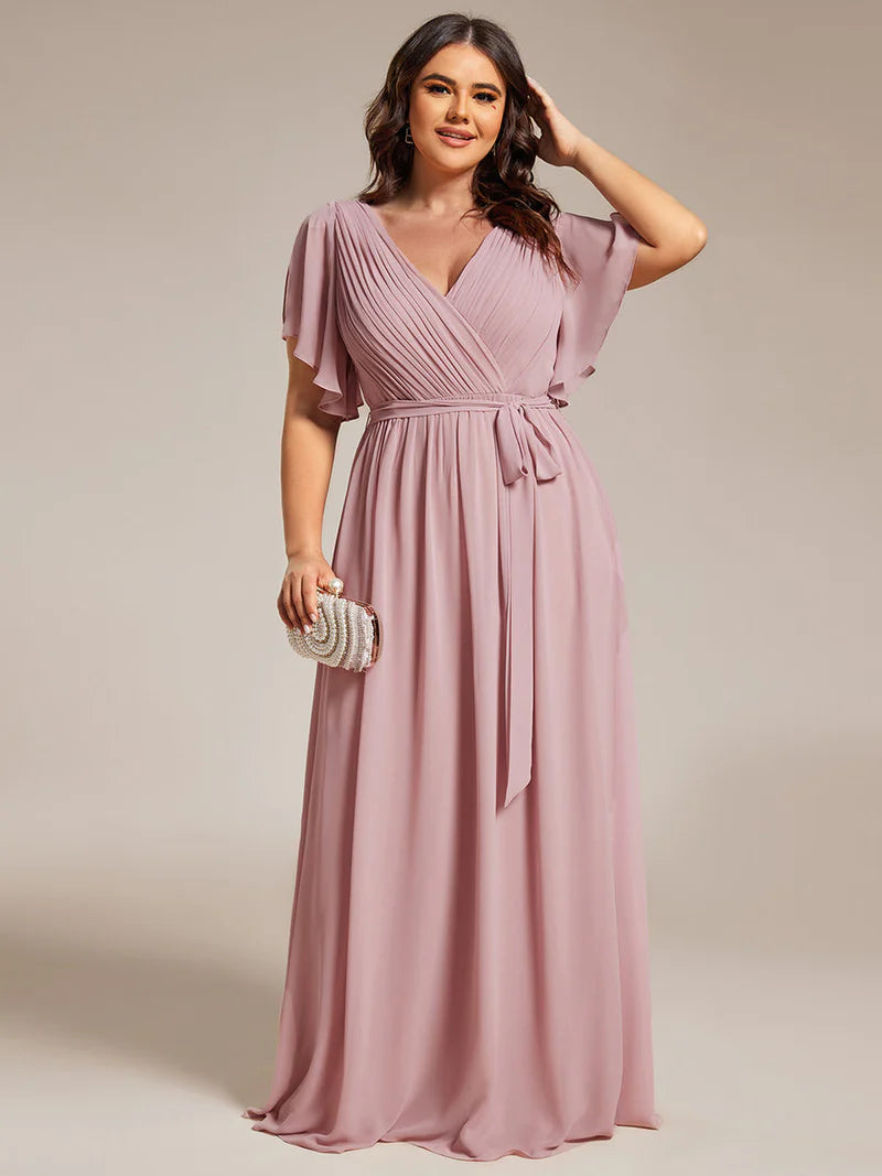 Dusty rose plus sized bridesmaid dress with v-neck and a-line.