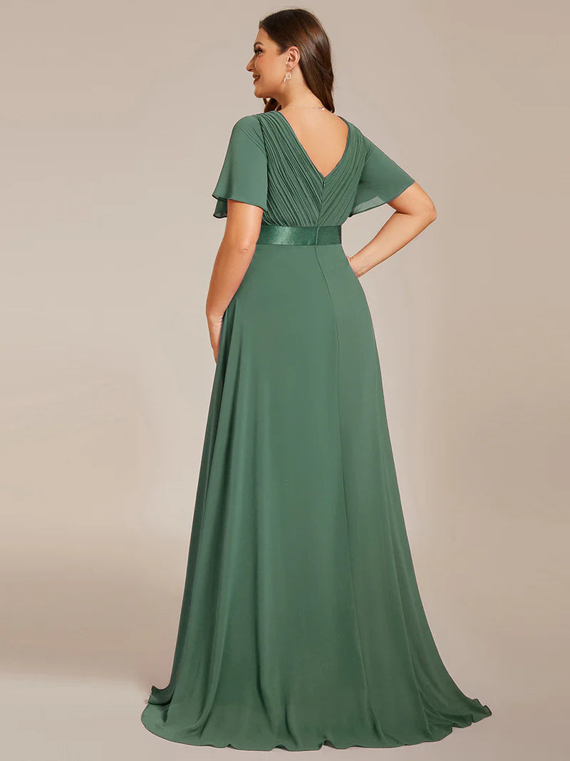 Eucalyptus green plus size bridesmaid dress or formal dress in chiffon with short sleeves and a satin band.