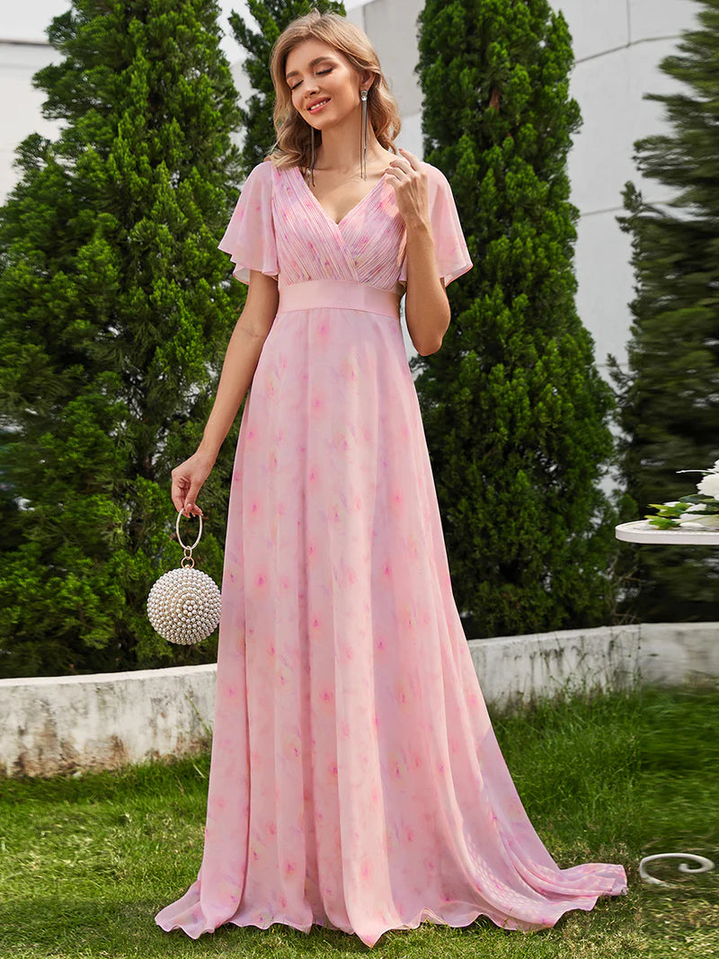 Floral pink formal dress in chiffon with satin band and short sleeves.