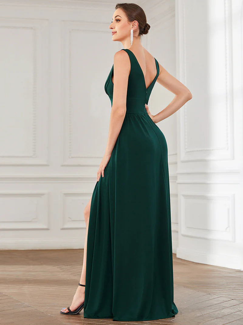 Dark green sleeveless formal dress with deep v neck and front split.