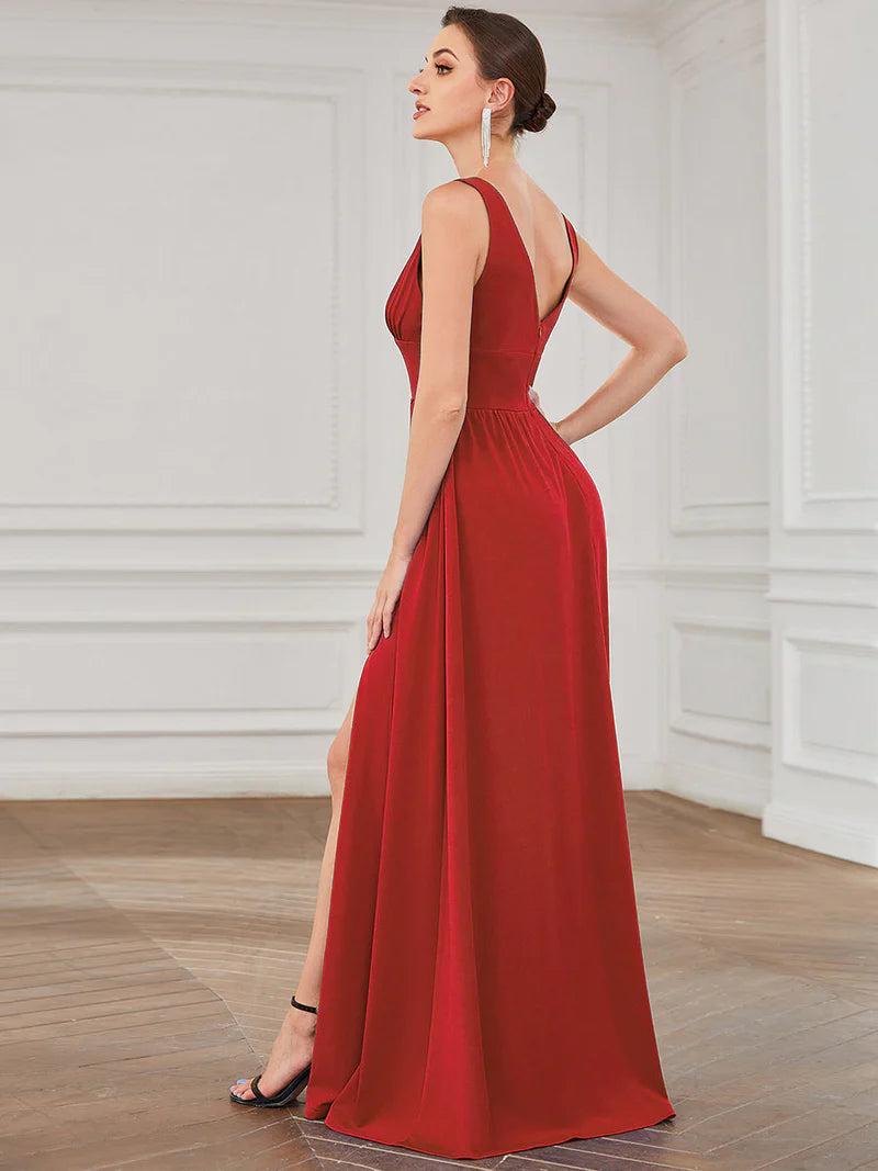 Red sleeveless formal dress with deep v neck and front split.
