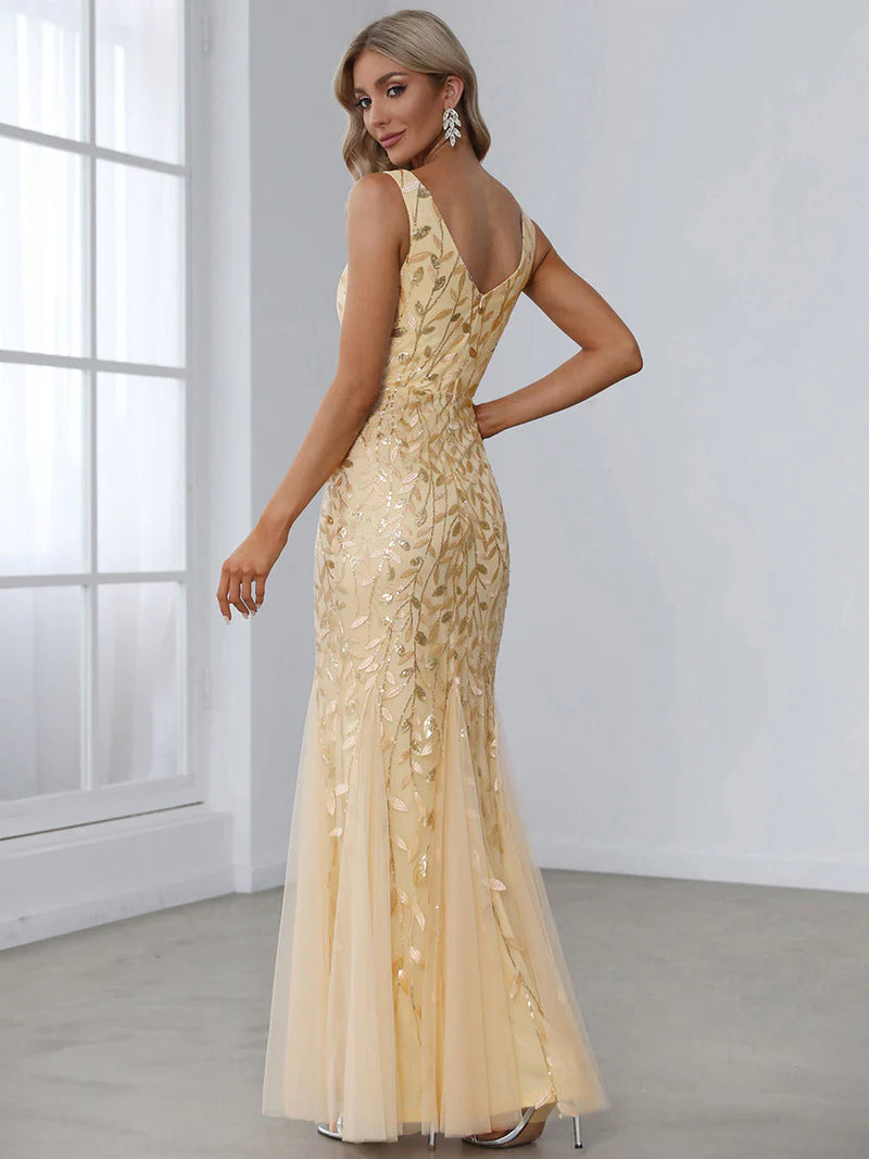 Gold formal dress with fishtail and sequins.