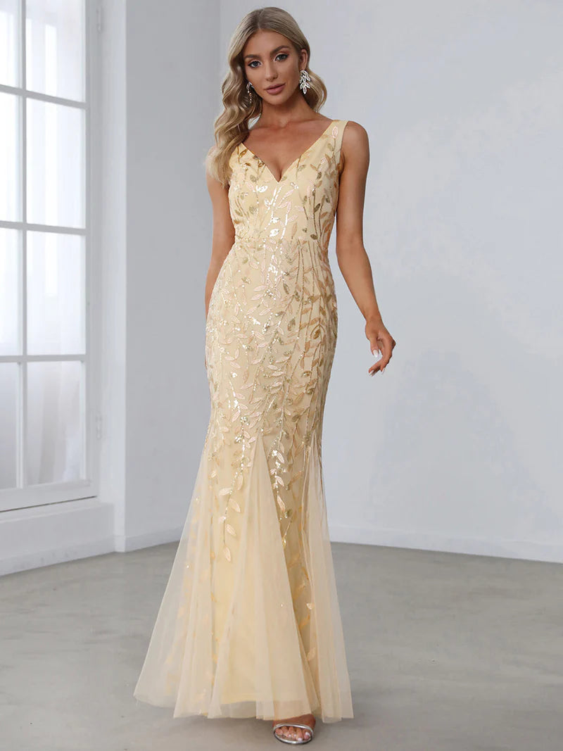 Gold formal dress with fishtail and sequins.