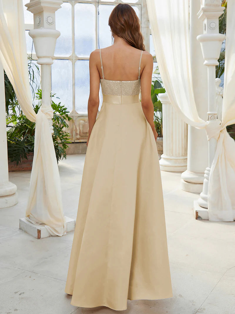Gold hi low sleeveless satin formal or mother of the bride dress with bodice detailing.