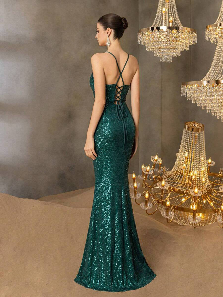 Green formal dress with lace up back and sequins.