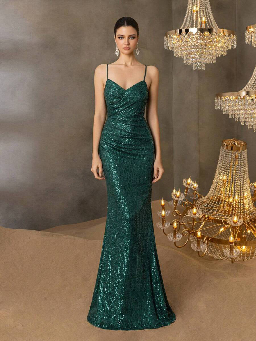 Green formal dress with lace up back and sequins.