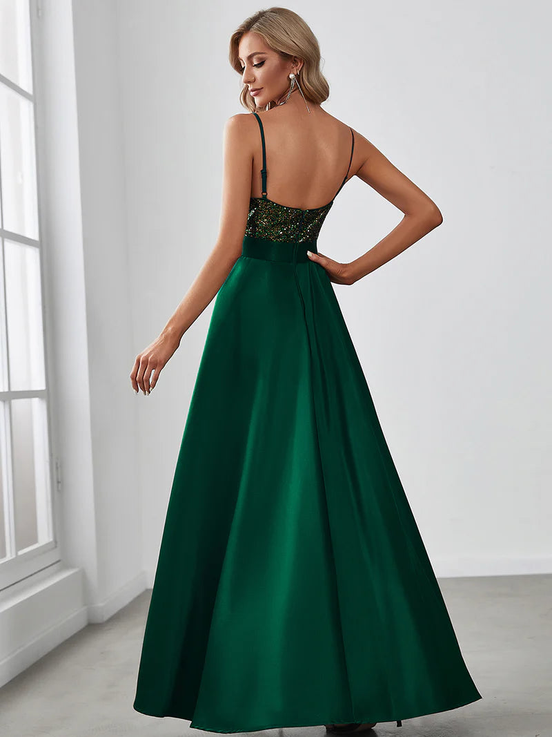 Green hi low sleeveless satin formal or mother of the bride dress with bodice detailing.