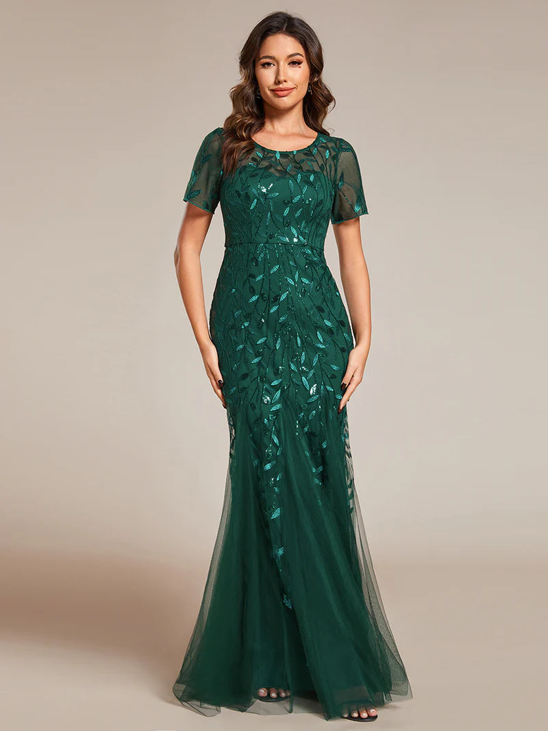 Green Mother of the bride dress, short sleeve with tulle, lace and sequin detailing.