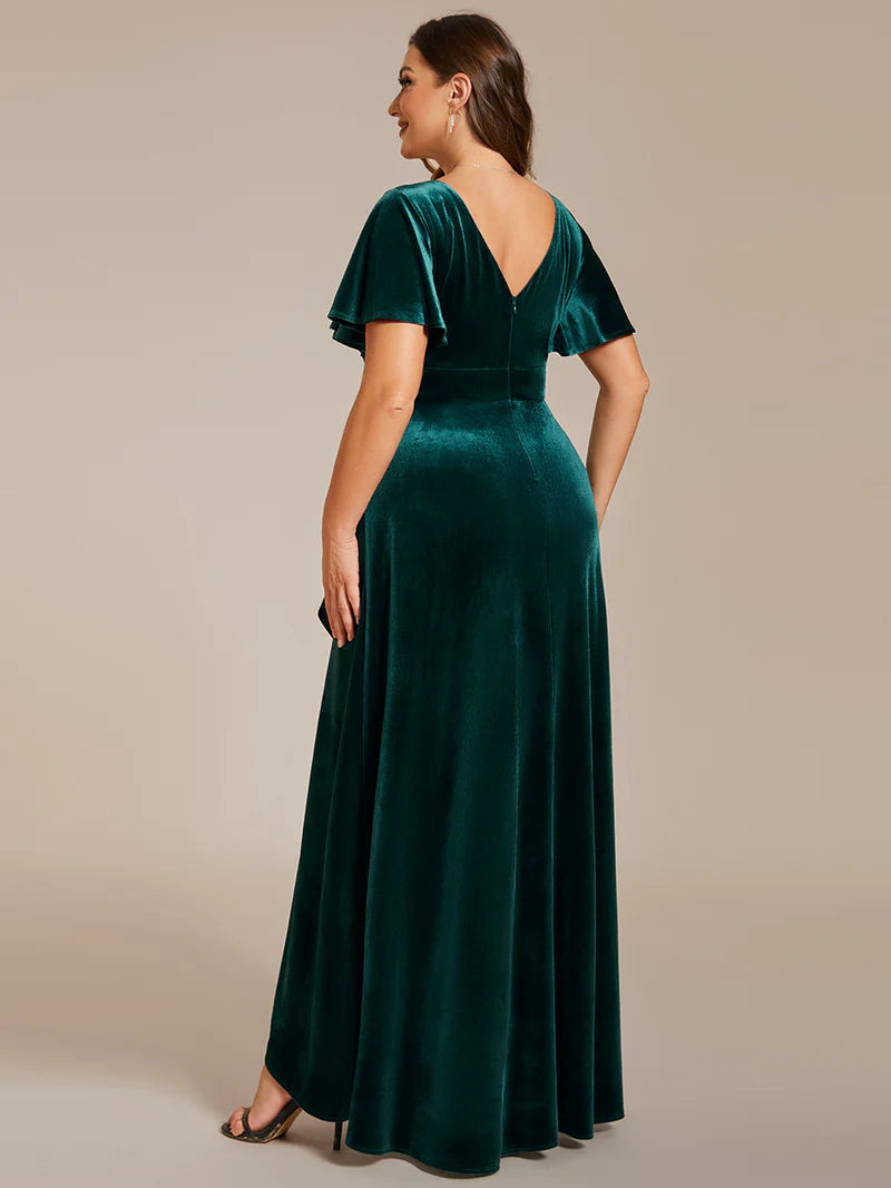 Green velvet plus size formal dress with asymetric hem.