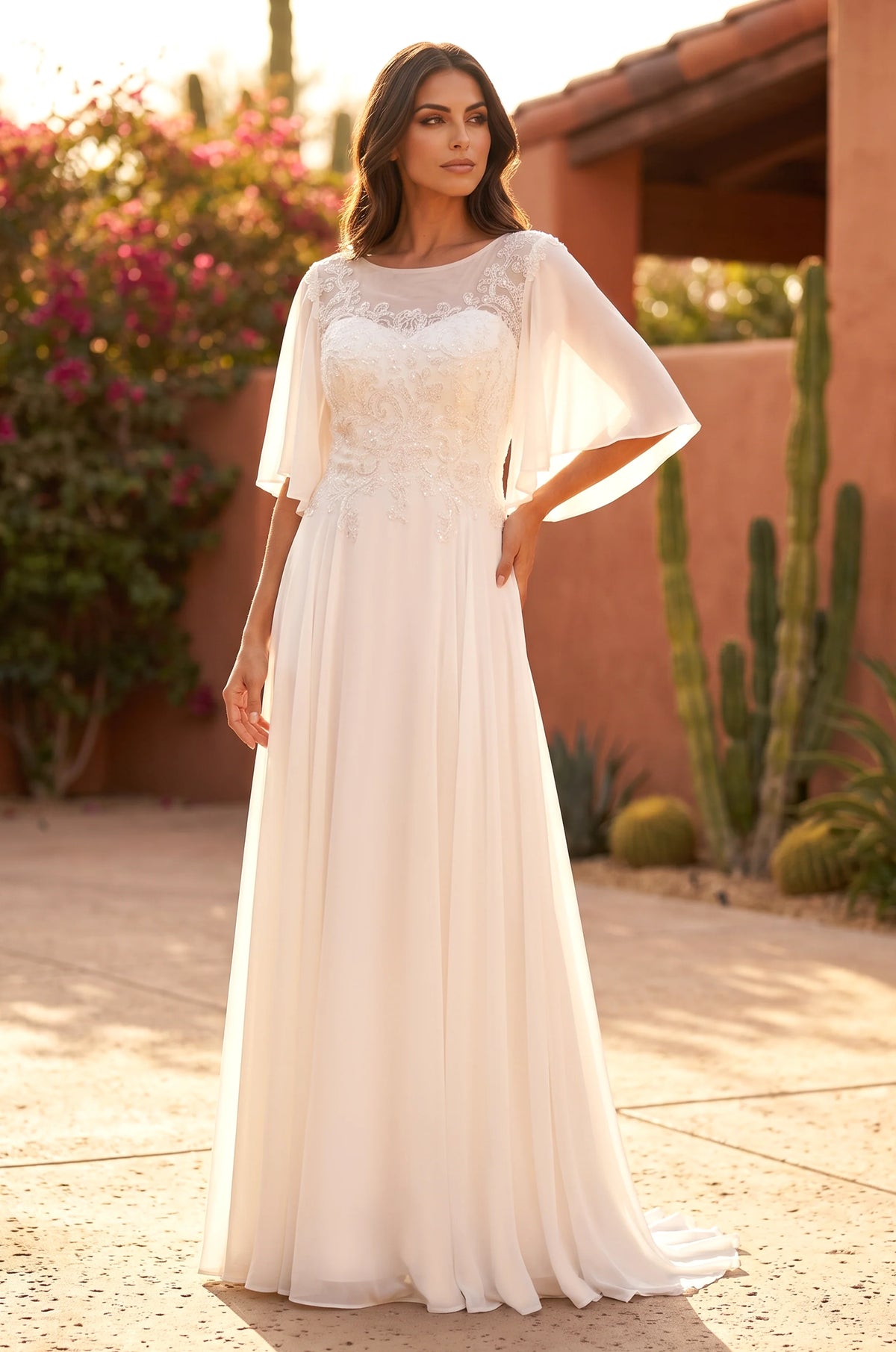 Ivory plus size wedding dress in chiffon with beaded bodice.