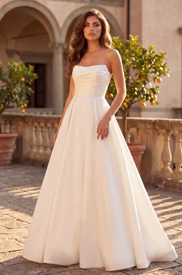 Ivory strapless wedding dress with lace up back.