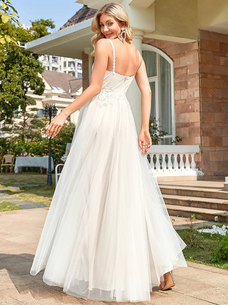 Ivory wedding dress with tulle skirt and lace applique bodice.