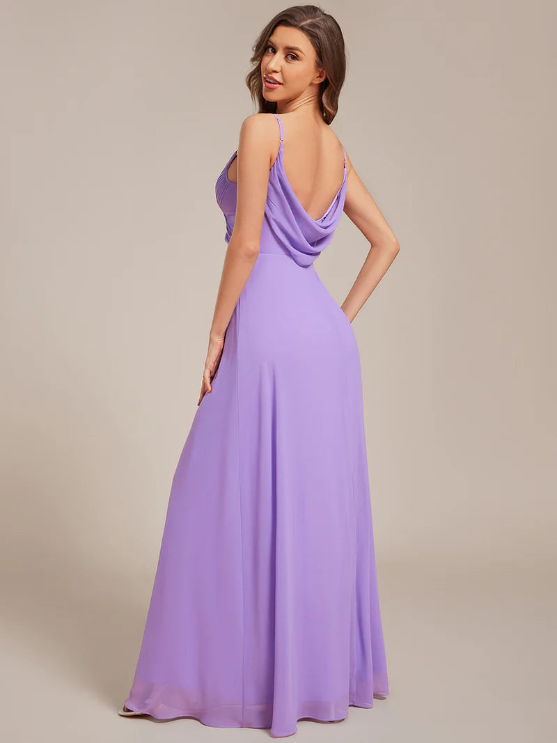 Sleeveless lavender bridesmaid dress with spaghetti straps.
