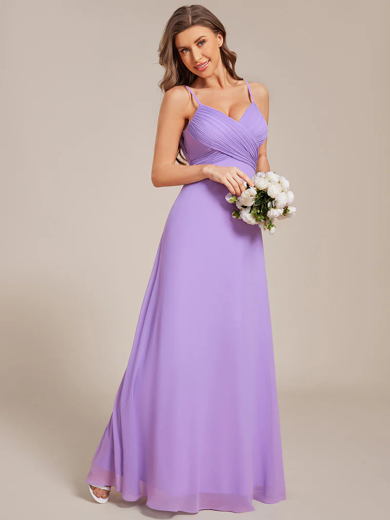Sleeveless lavender bridesmaid dress with spaghetti straps.