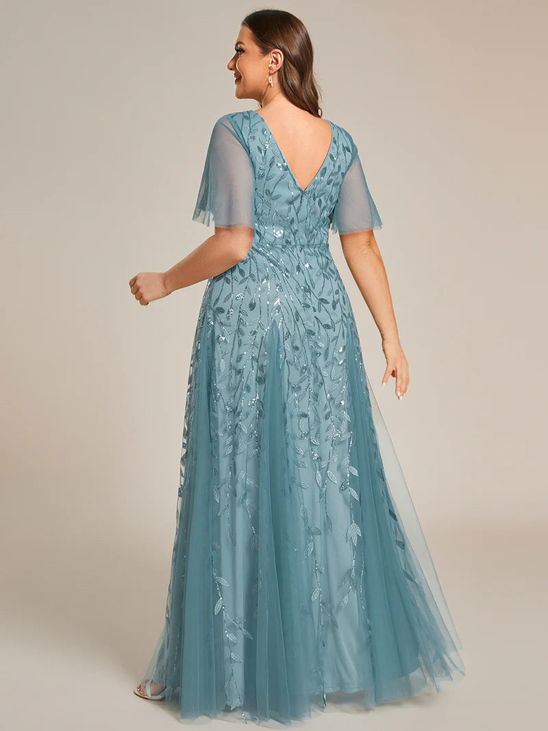 Light Teal plus size mother of the bride dress with short sleeves and flowing tulle.
