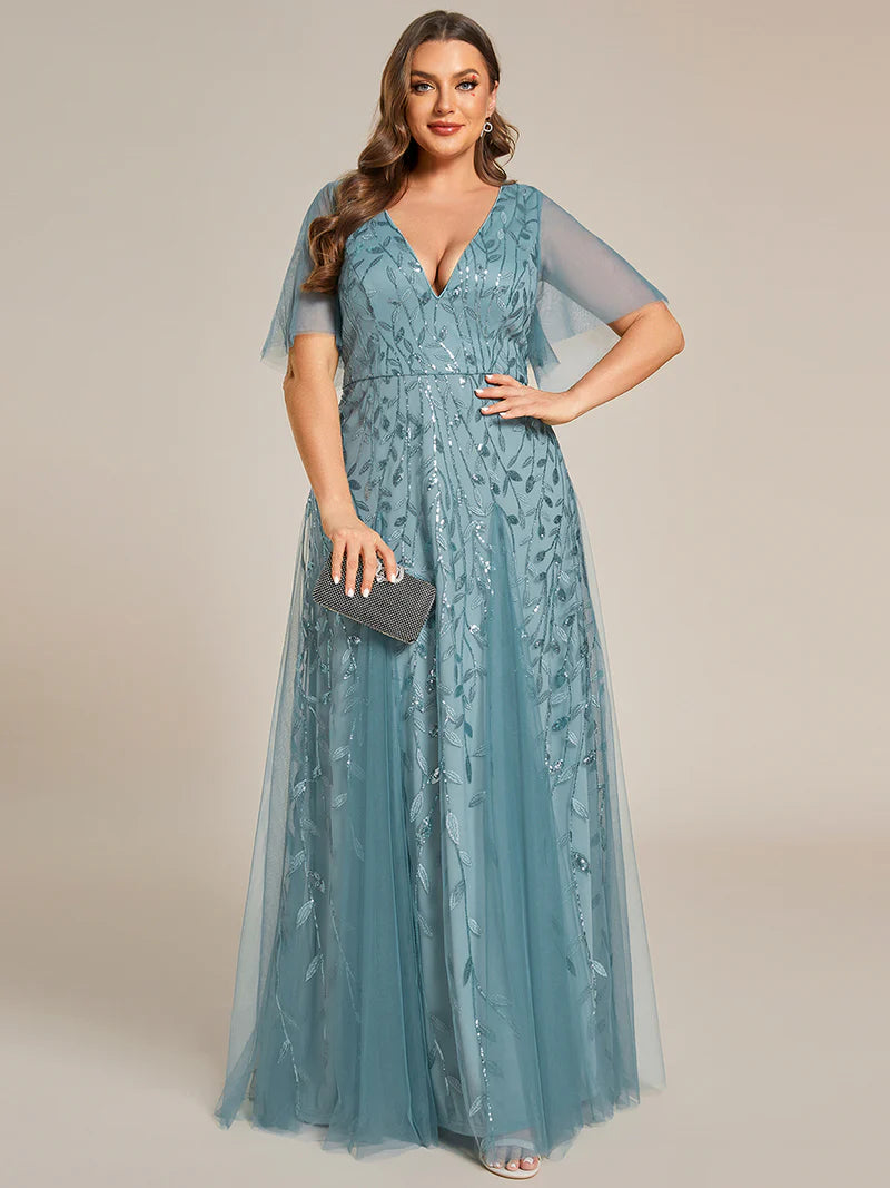 Light Teal plus size mother of the bride dress with short sleeves and flowing tulle.