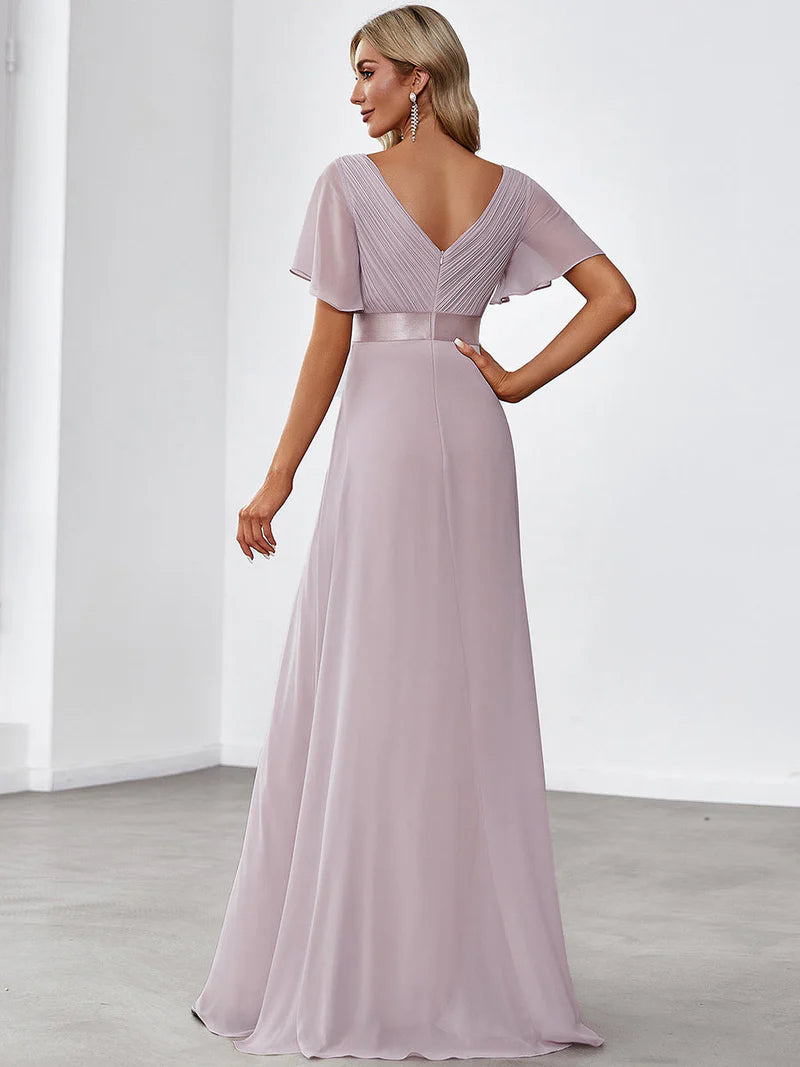 Lilac formal dress in chiffon with satin band and short sleeves.