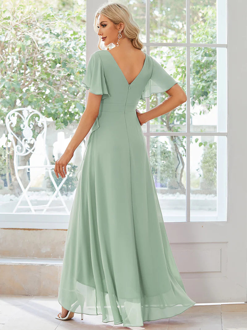 Mint green bridesmaid dress with high low ruffle and chiffon.
