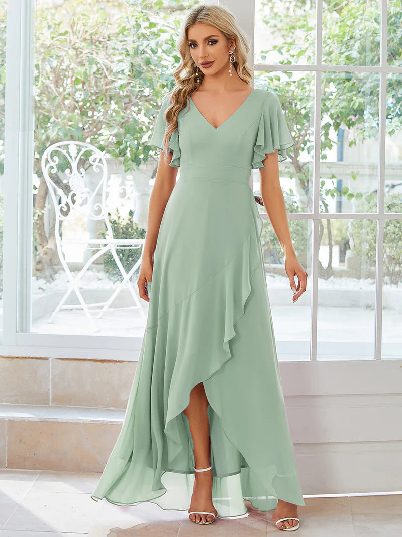 Mint green bridesmaid dress with high low ruffle and chiffon.