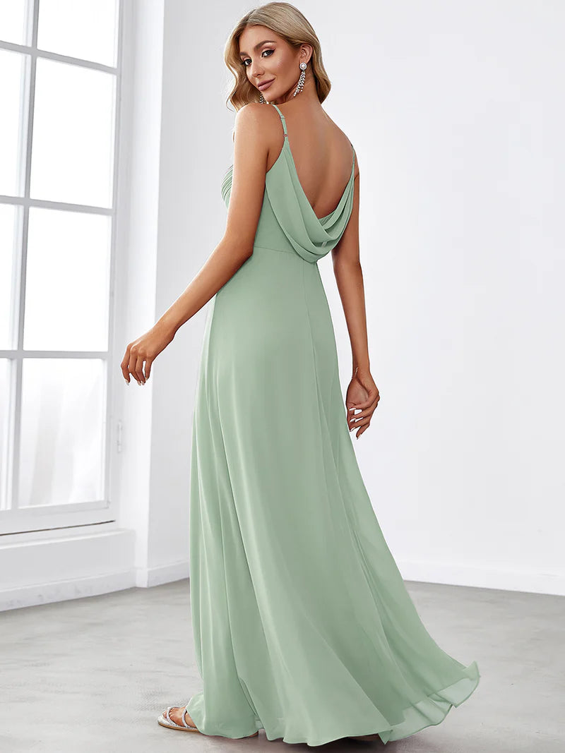 Sleeveless mint green bridesmaid dress with spaghetti straps.