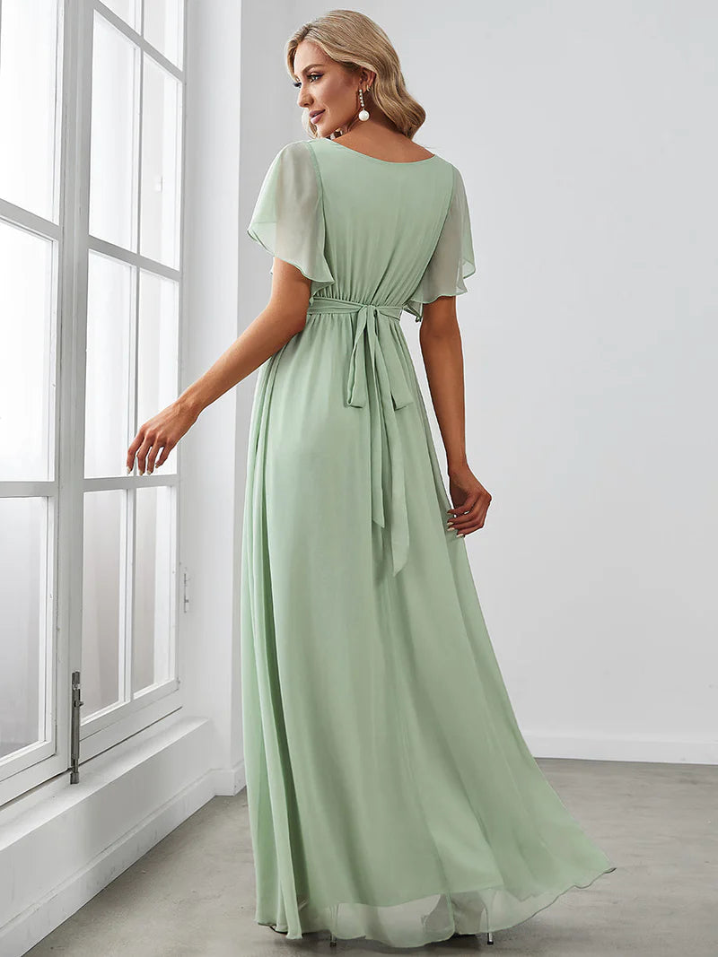 Mint green bridesmaid dress with v-neck and a-line.