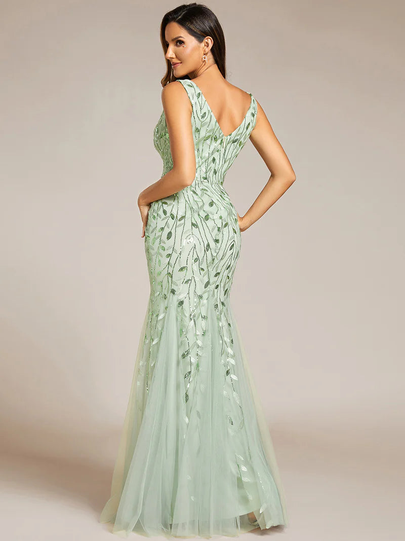 Mint green formal dress with fishtail and sequins.