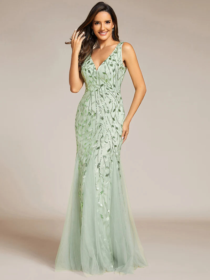 Mint green formal dress with fishtail and sequins.