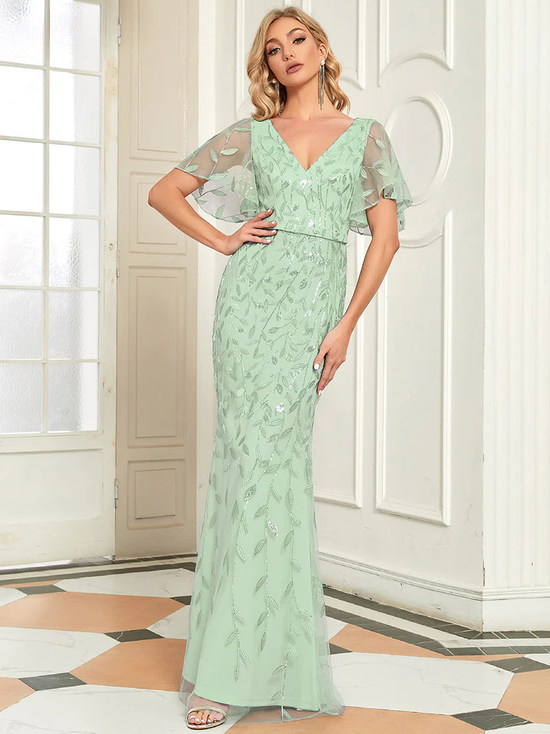 Mint Green Mother of the bride dress with tulle, sequins and lace ruffle sleeves.