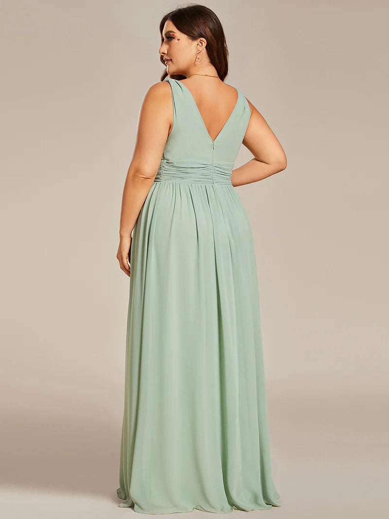 Mint green plus sized bridesmaid dress with double v-neck and chiffon.