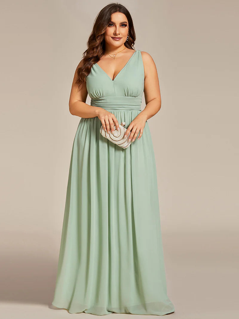 Mint green plus sized bridesmaid dress with double v-neck and chiffon.