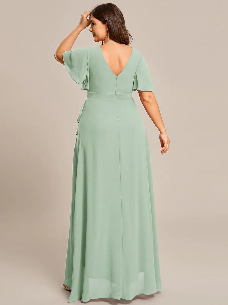 Mint green plus sized bridesmaid dress with high low ruffle and chiffon.