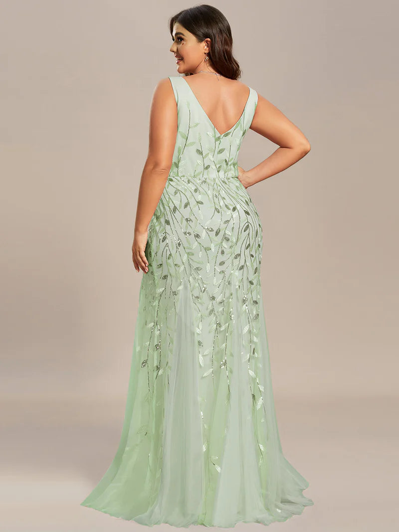 Mint green plus sized dress with fishtail and sequin.