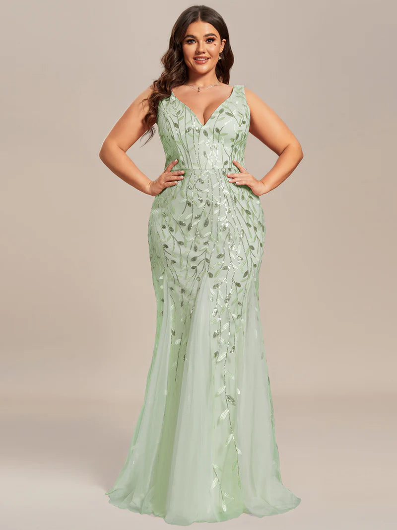 Mint green plus sized dress with fishtail and sequin.