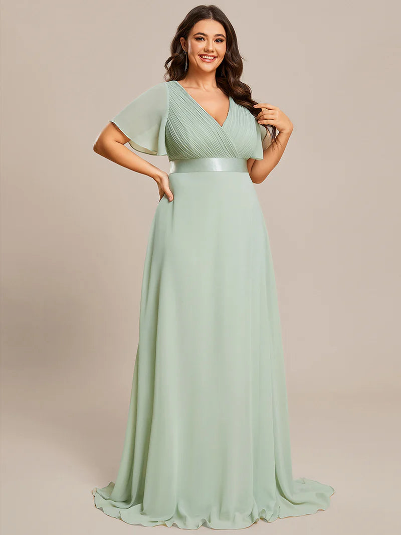 Mint Green plus size mother of the bride dress in chiffon with short sleeves and a satin band.