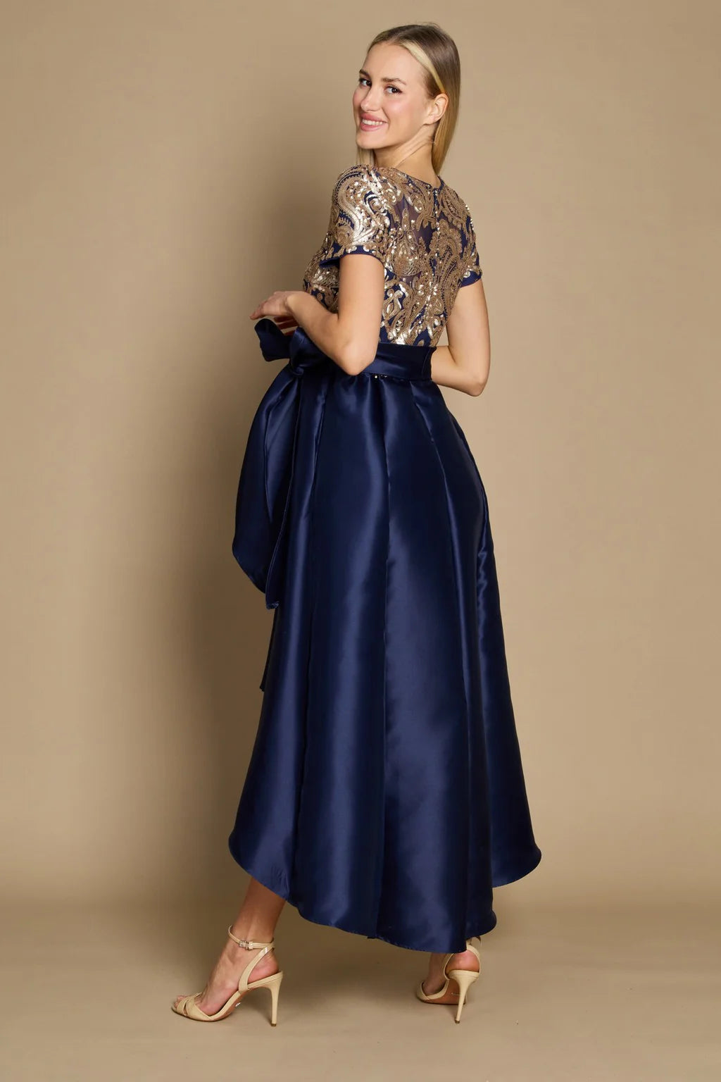Navy blue Mother of the bride Hi Low dress with gold sequin detail on the top along with belt.