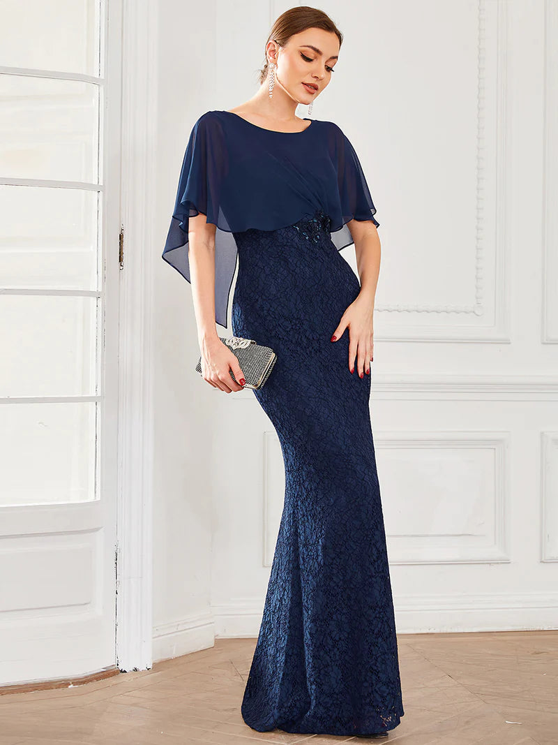 Navy blue Mother of the Bride dress with fishtail finish, lace with chiffon cape ruffle sleeves. Graceful Elegance bridal shop services Logan, Brisbane, Gold Coast, Scenic Rim.