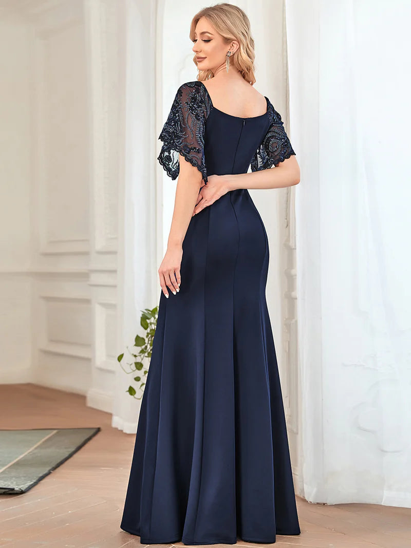 Navy blue mother of the bride dress with lace sleeves, v-neck and fishtail.